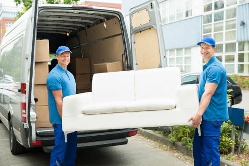 Removal team sorting recyclable packing materials in Clapham