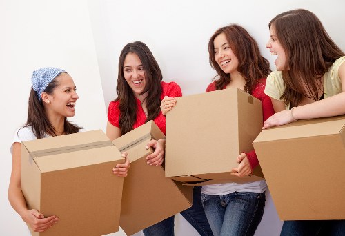Packed moving boxes and furniture prepared for transport