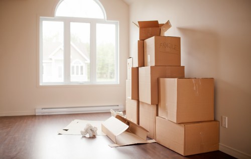 Furniture pick-up service removing a sofa in Clapham