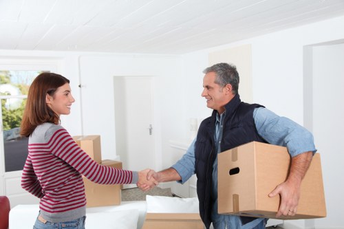 Manager reviewing a removals complaint with service records