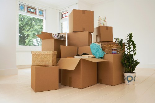 Professional movers carrying items in a Clapham flat move