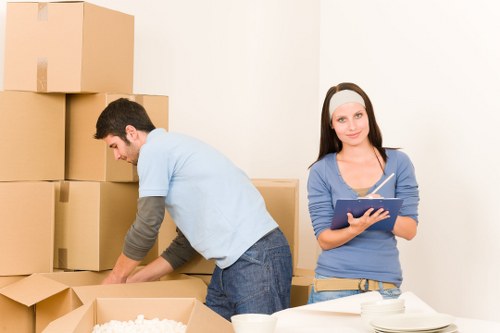 Office relocation team moving equipment in Clapham