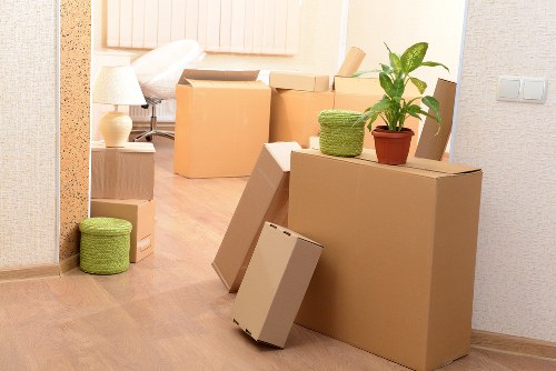 Local movers organizing boxes during a Clapham house move