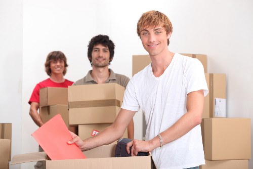 Removal team handling furniture during a Clapham move