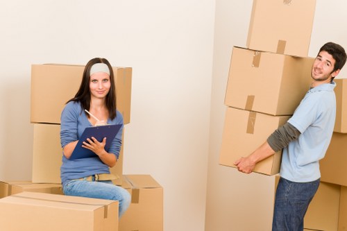 Staff using safe handling methods during a property move